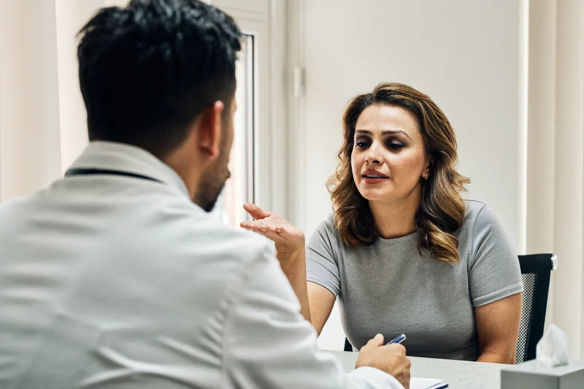 A frustrated patient talking with a doctor