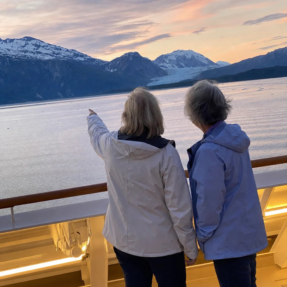 Two sisters at the ship rail at dusk